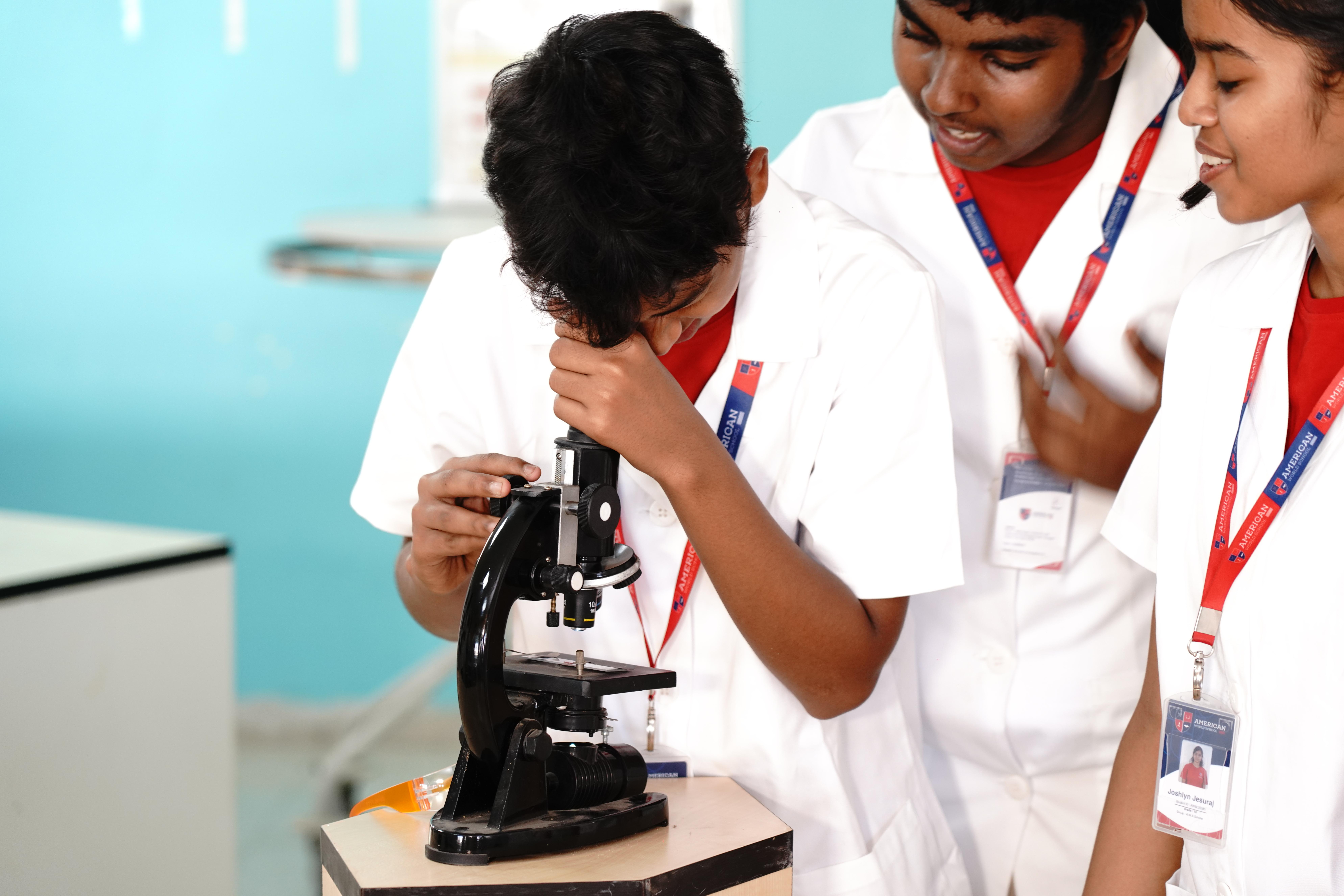 AWS students with microscope