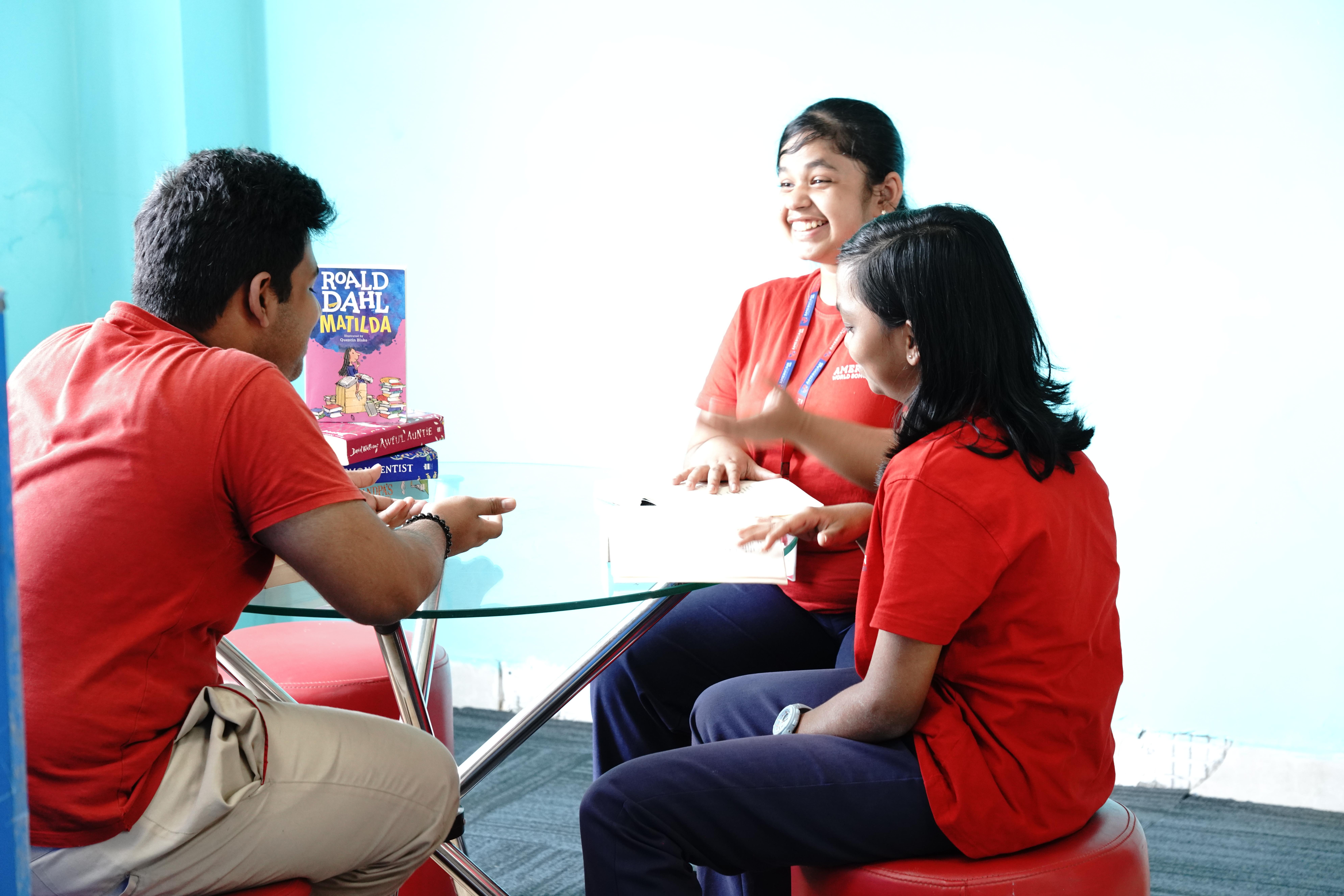 AWS students discussing books