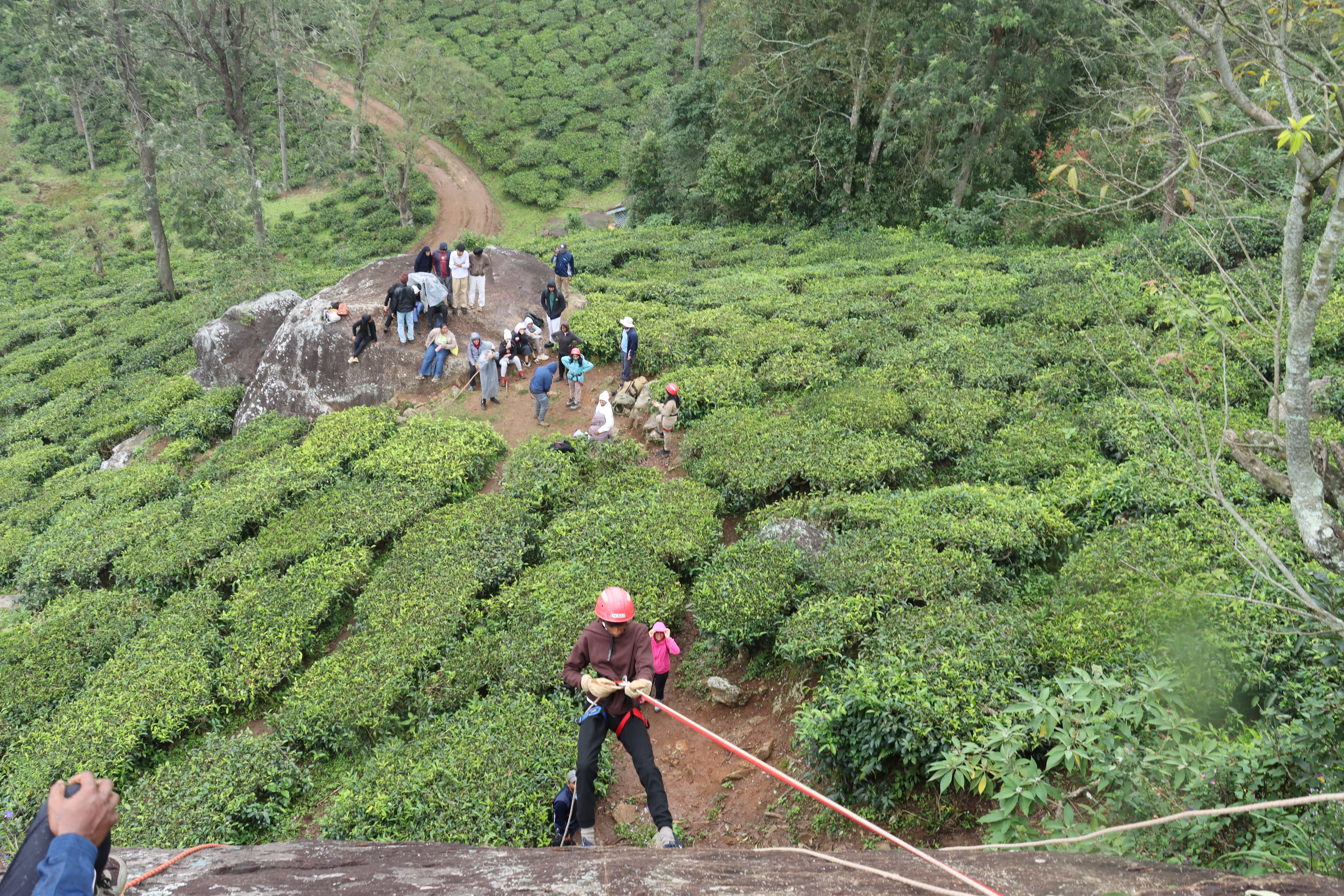 AWS student rappelling down a cliff with safety equipment