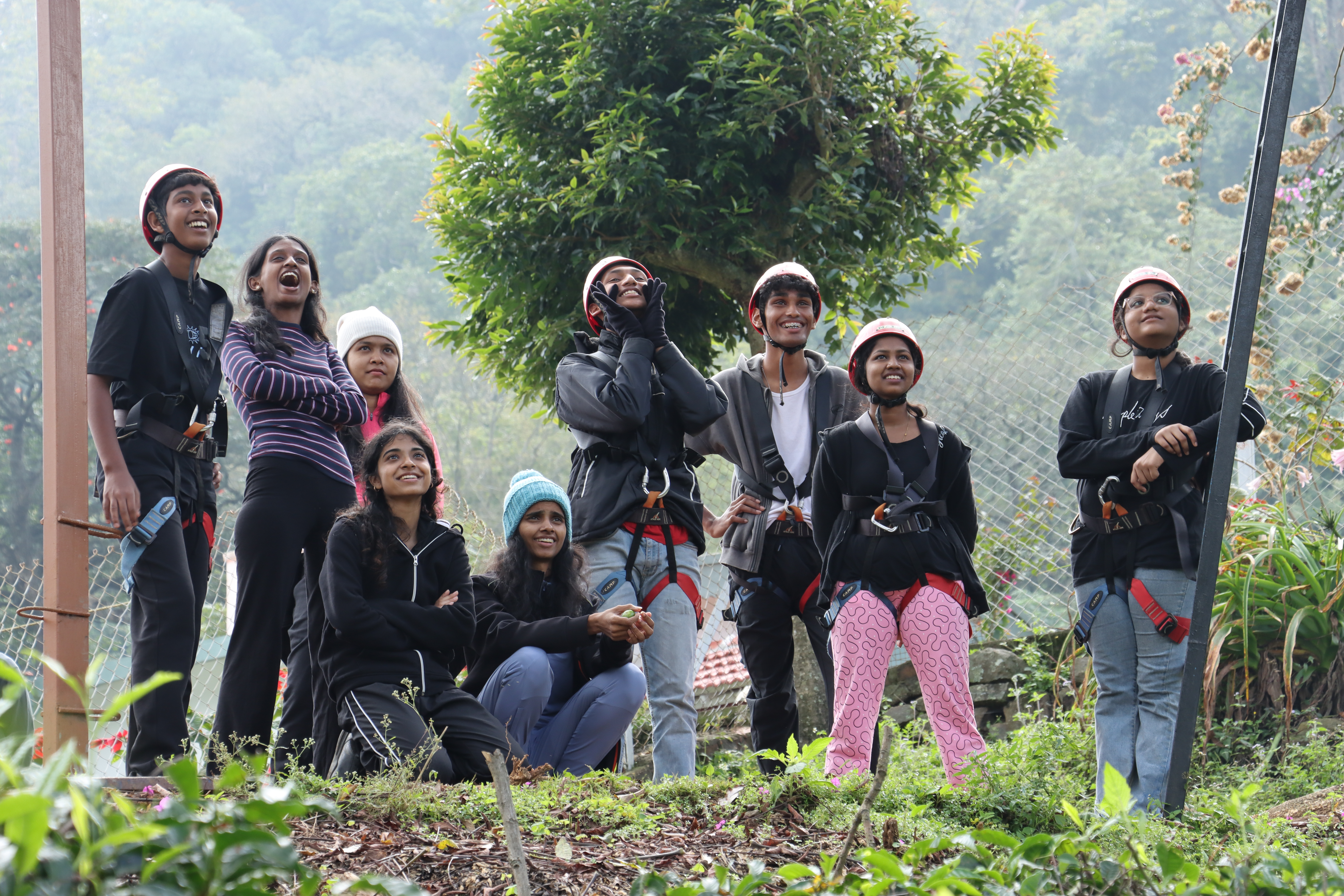AWS students in climbing helmets and harnesses outdoors