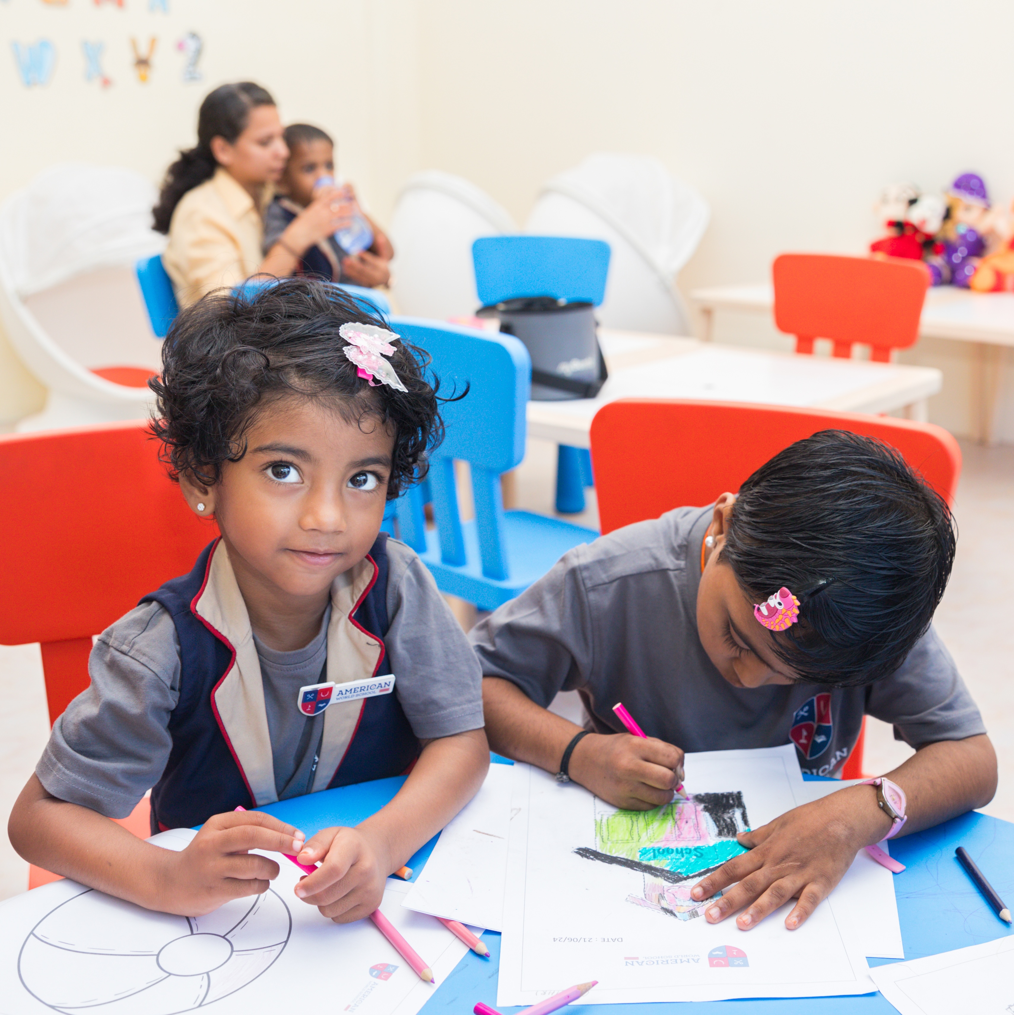 AWS Early Years children colouring at table