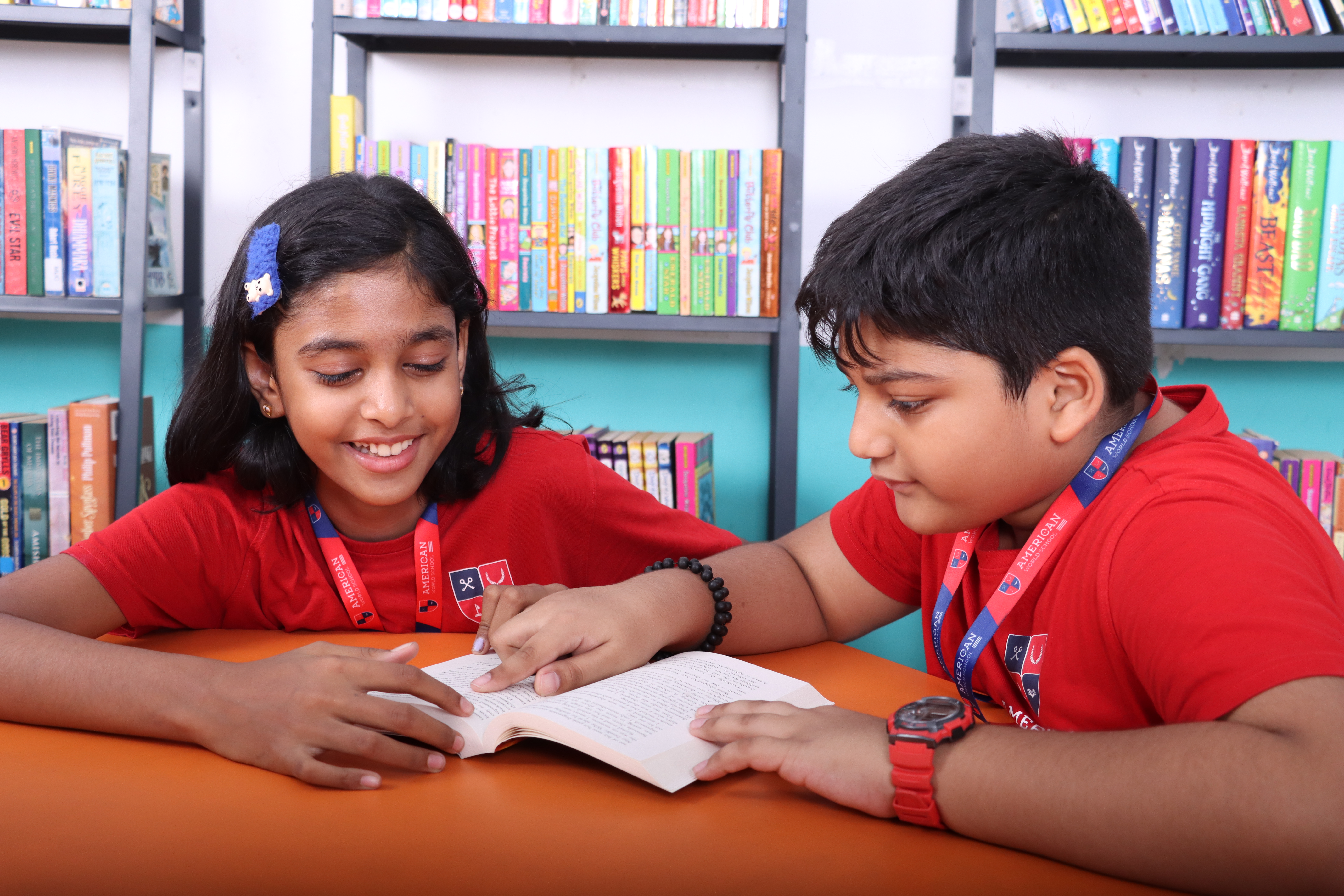 Lower Elementary students reading together at AWS