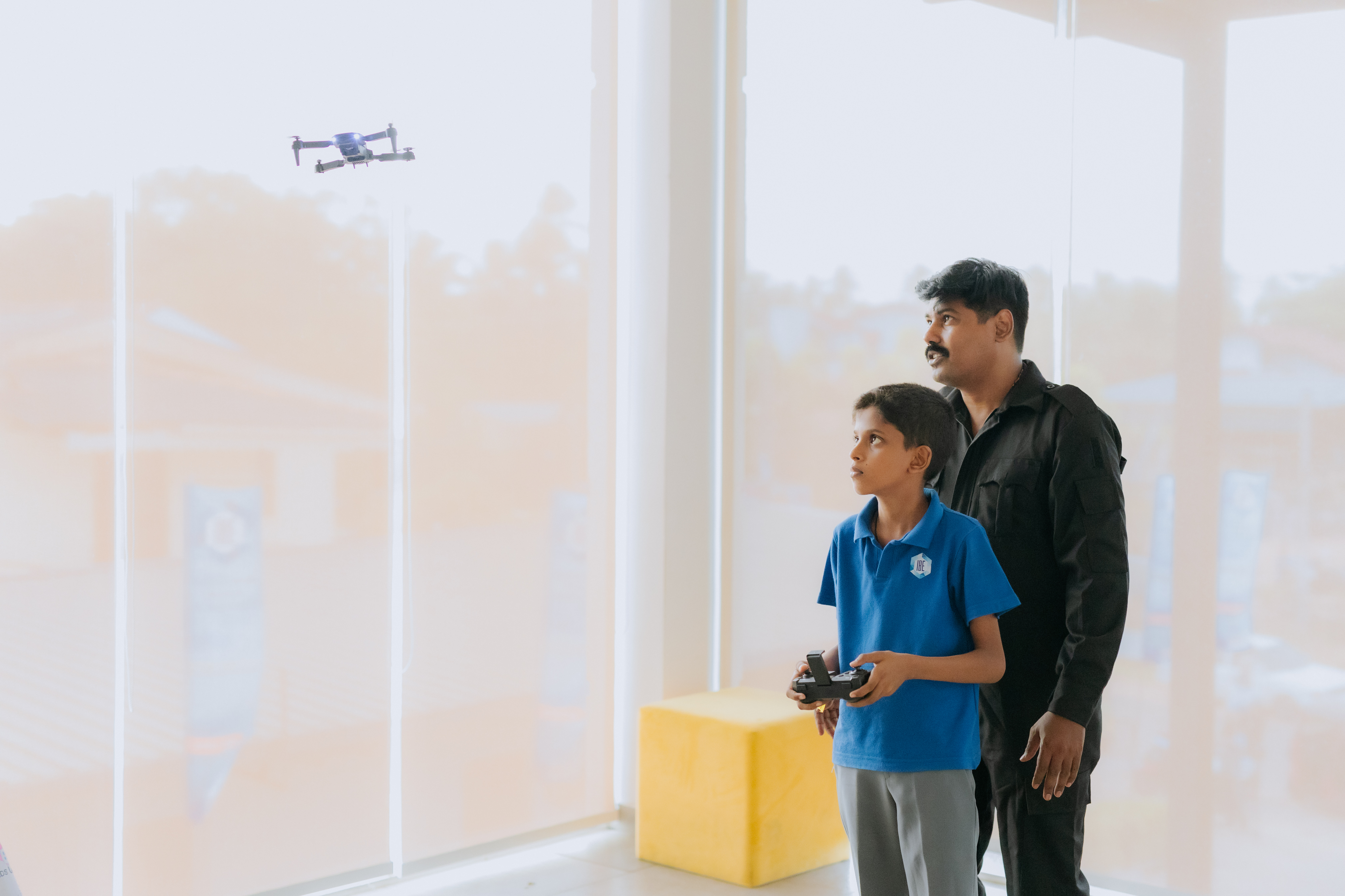 AWS student flying a drone with mentor guidance