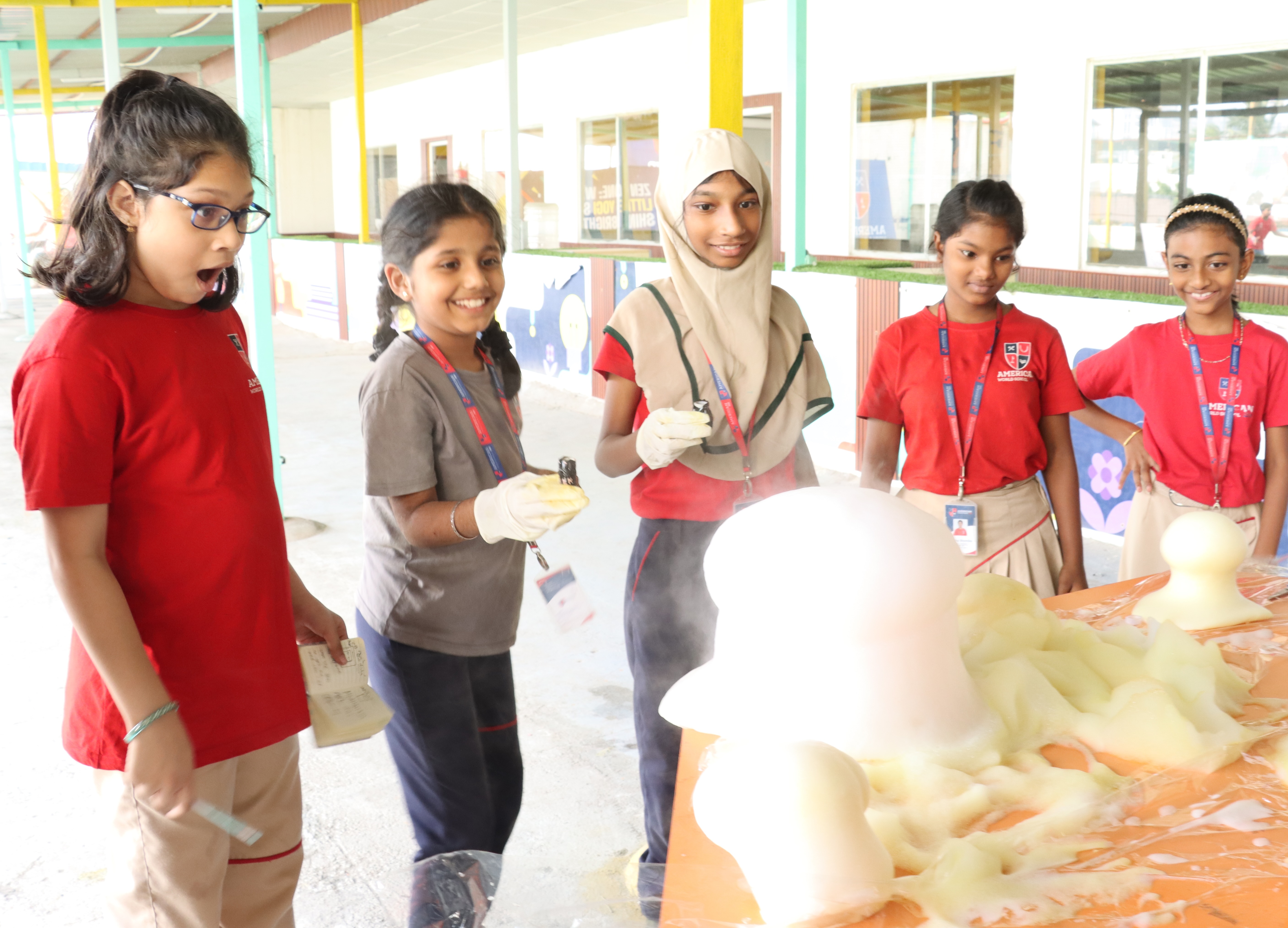 AWS upper elementary students running a soap chemistry experiment