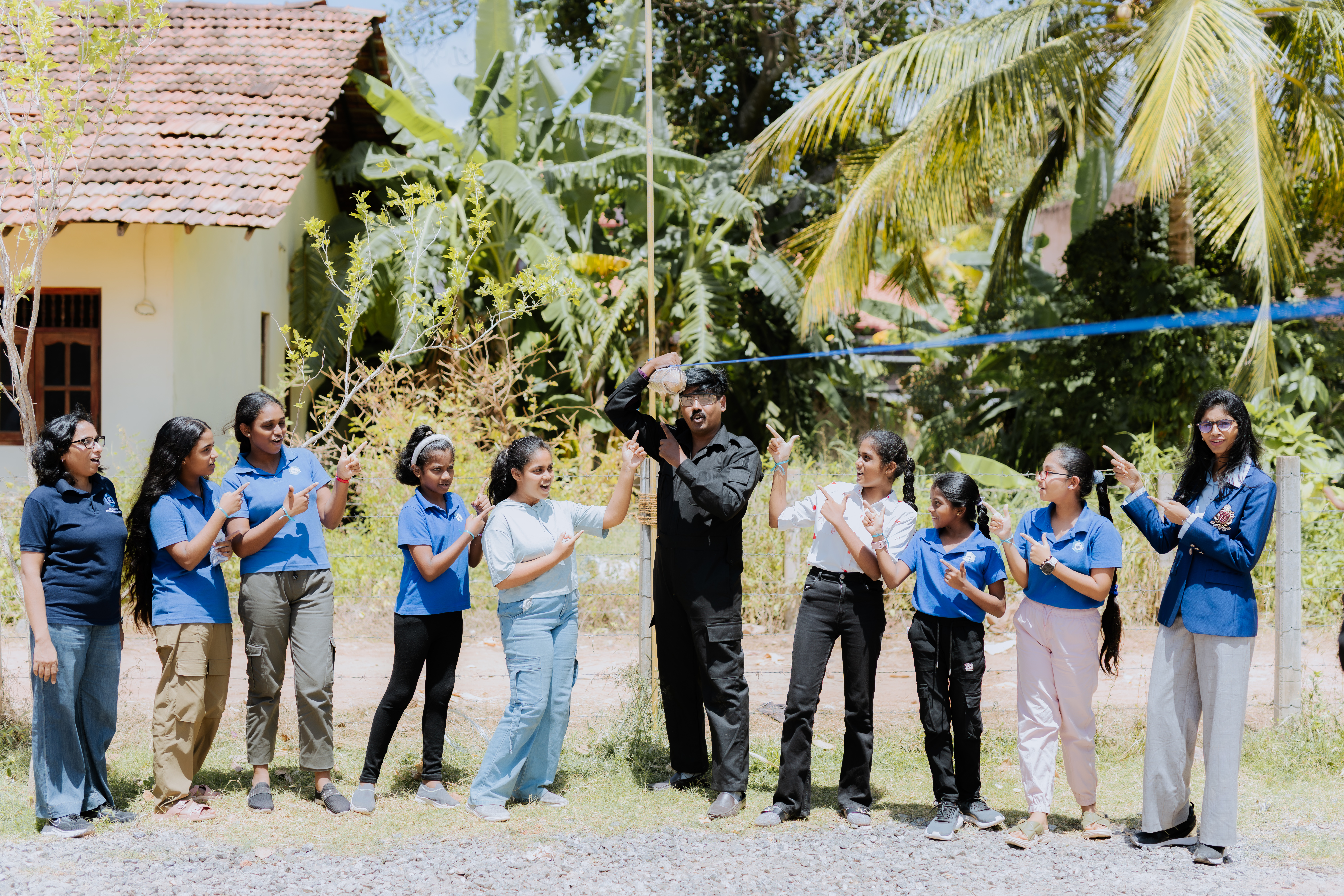 AWS students celebrating a water rocket launch outdoors