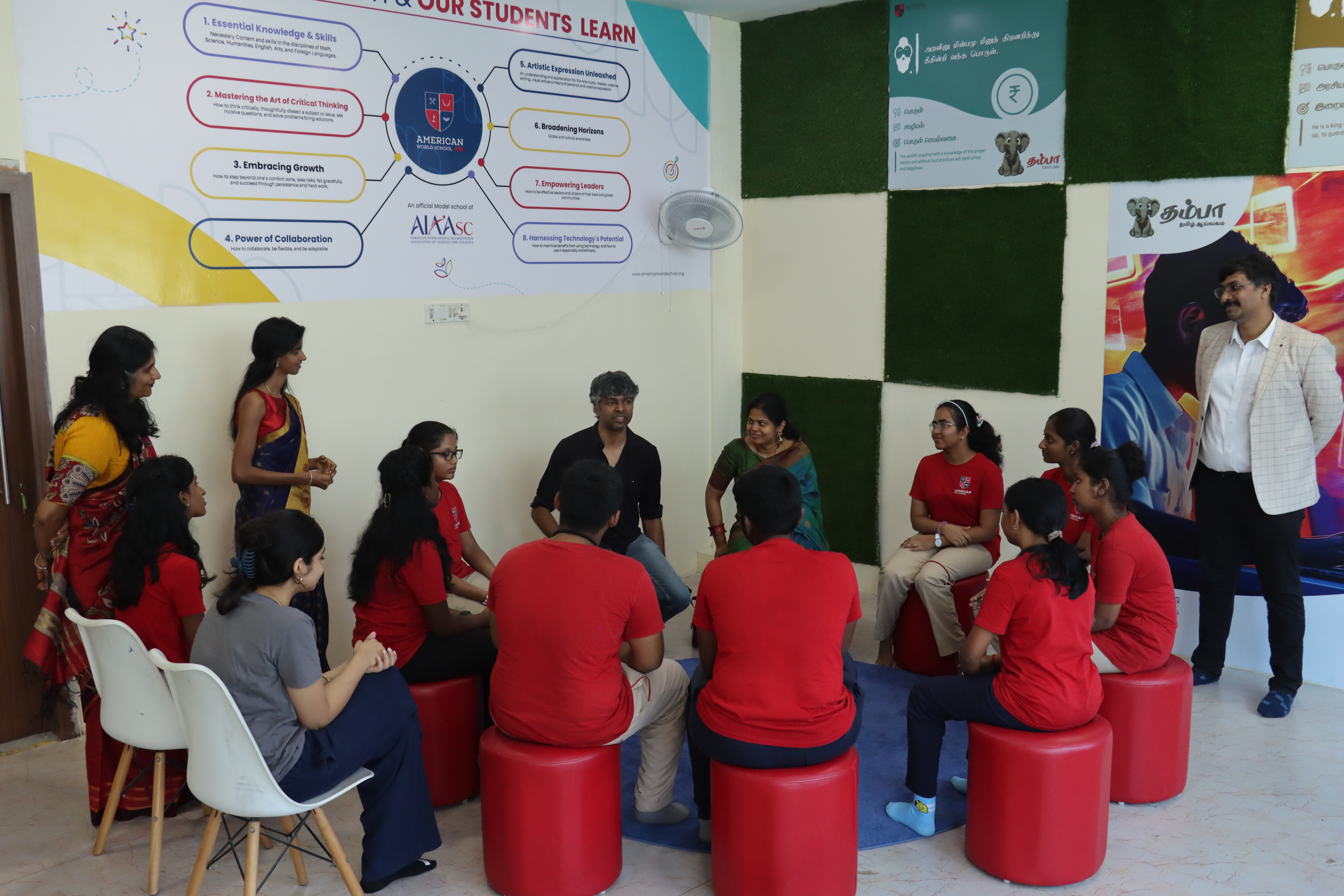 AWS teacher mentoring a circle of students