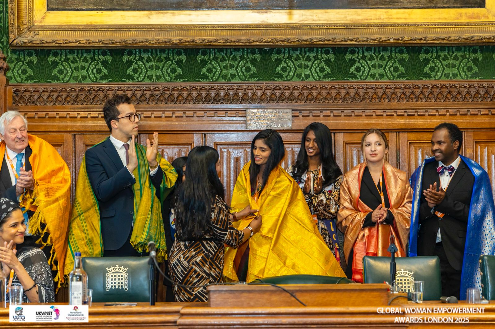 Dr. Mohana Lakshmi receiving the Global Women Empowerment Award at the UK Parliament