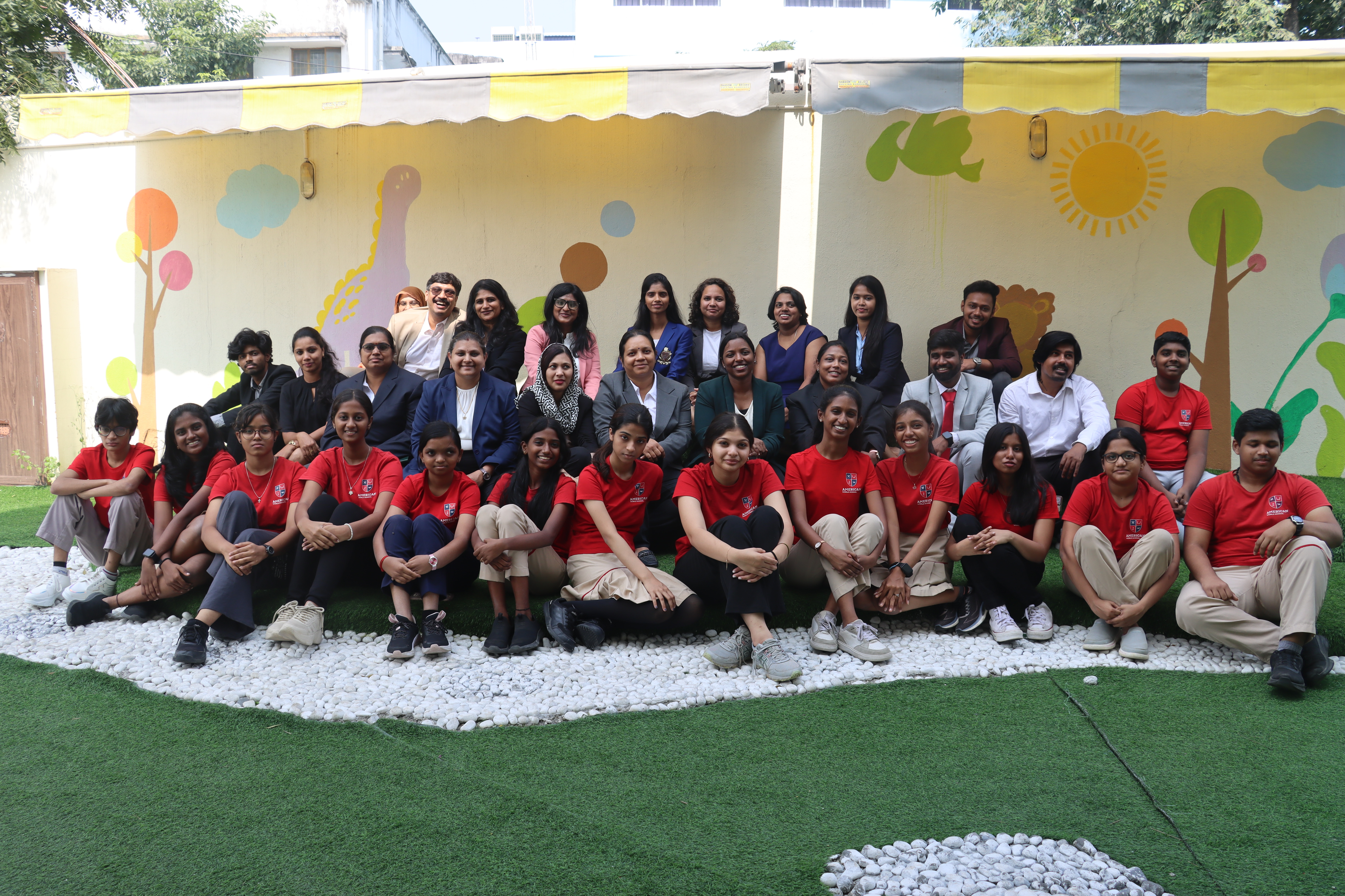 AWS staff and students in a large family group photo